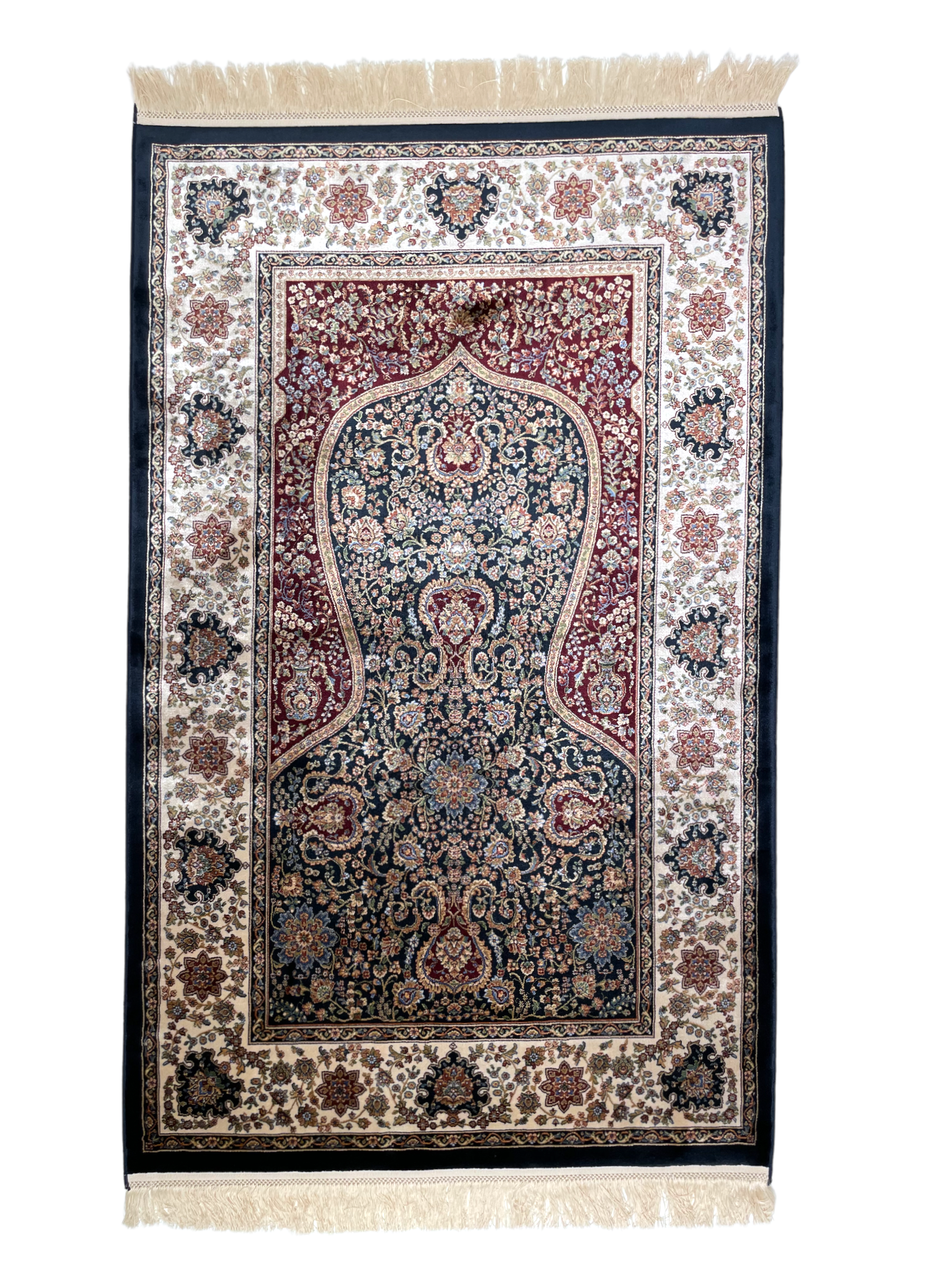 The Himma rug displays the traditional Islamic "mihrab" design with elegant floral elements. 